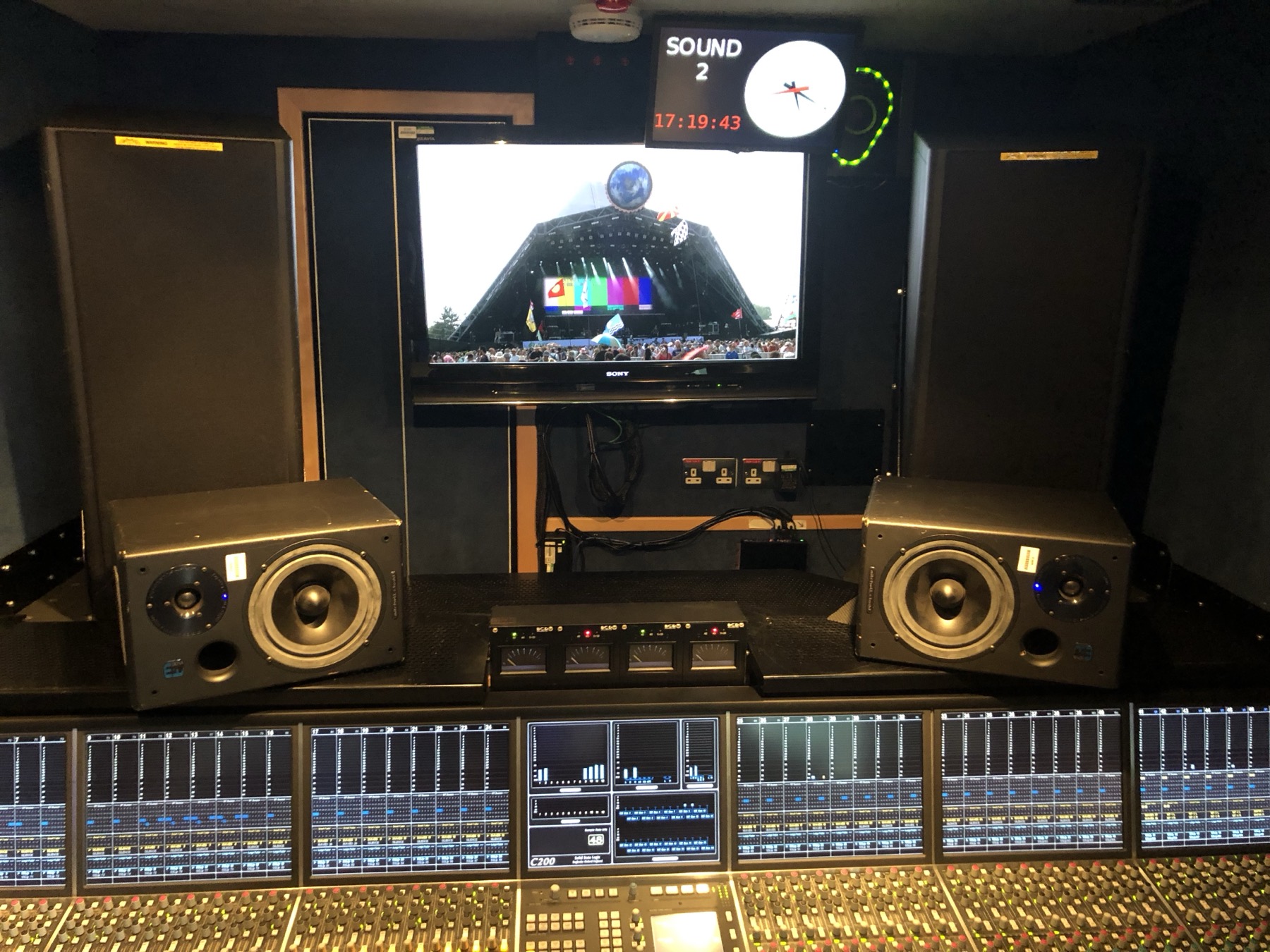 Outside broadcast truck with the Pyramid Stage on the monitor
